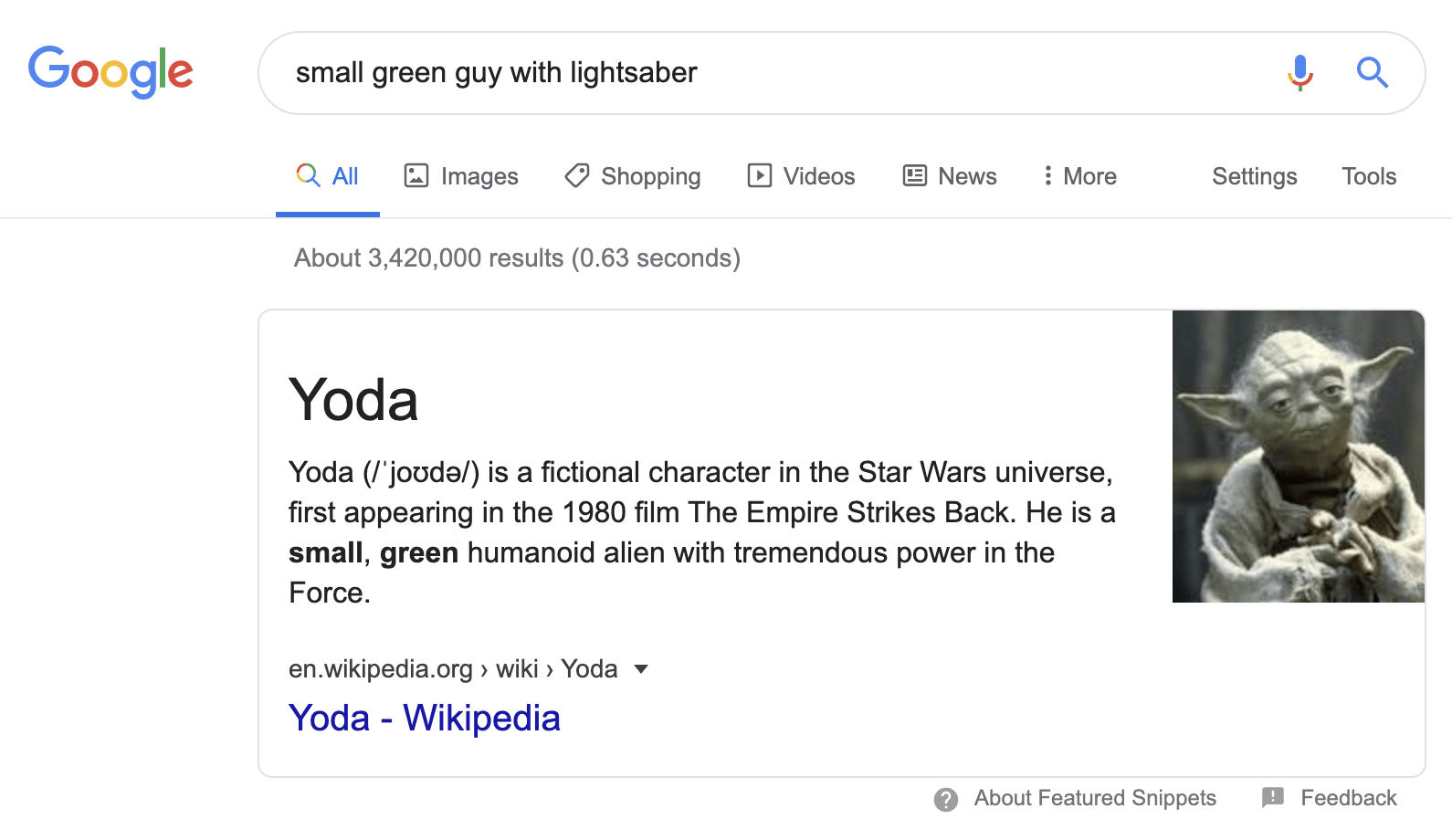 small green guy with lightsaber