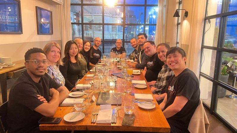 Ahrefs team sitting around the dinner table at the Salt Room
