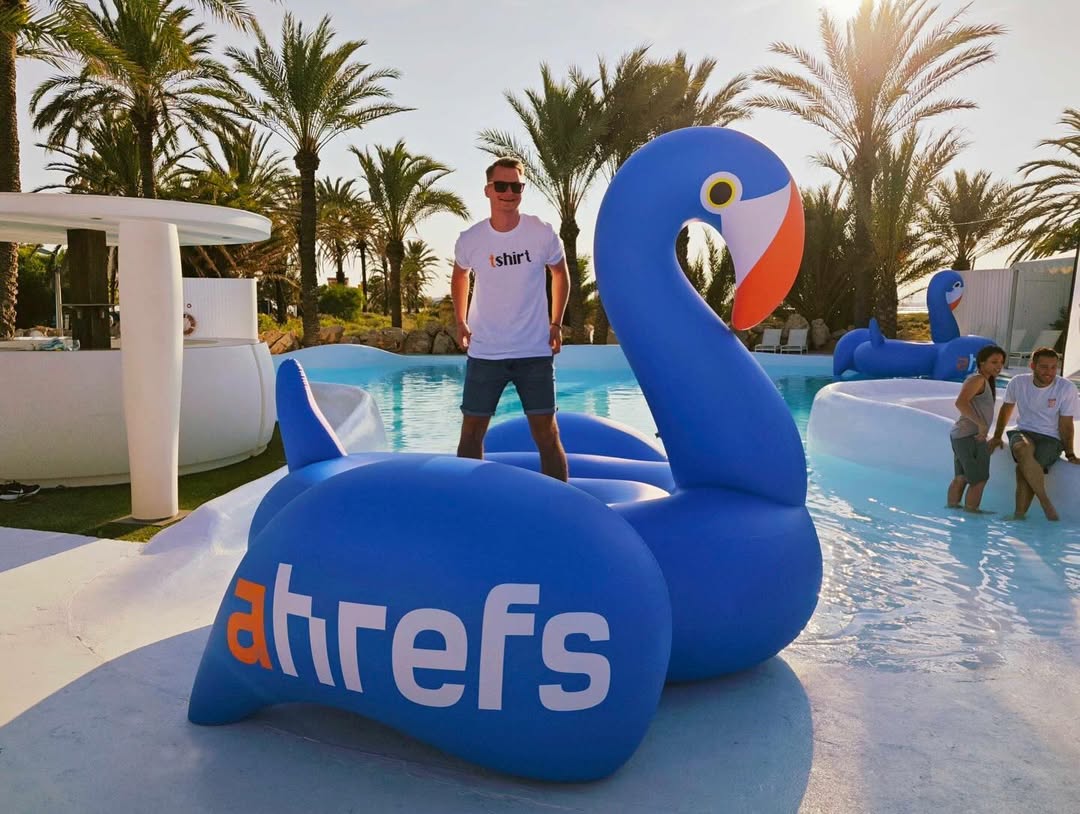 Photo of our Head of International Marketing, Erik Sarissky, standing on top of our branded floatmingo