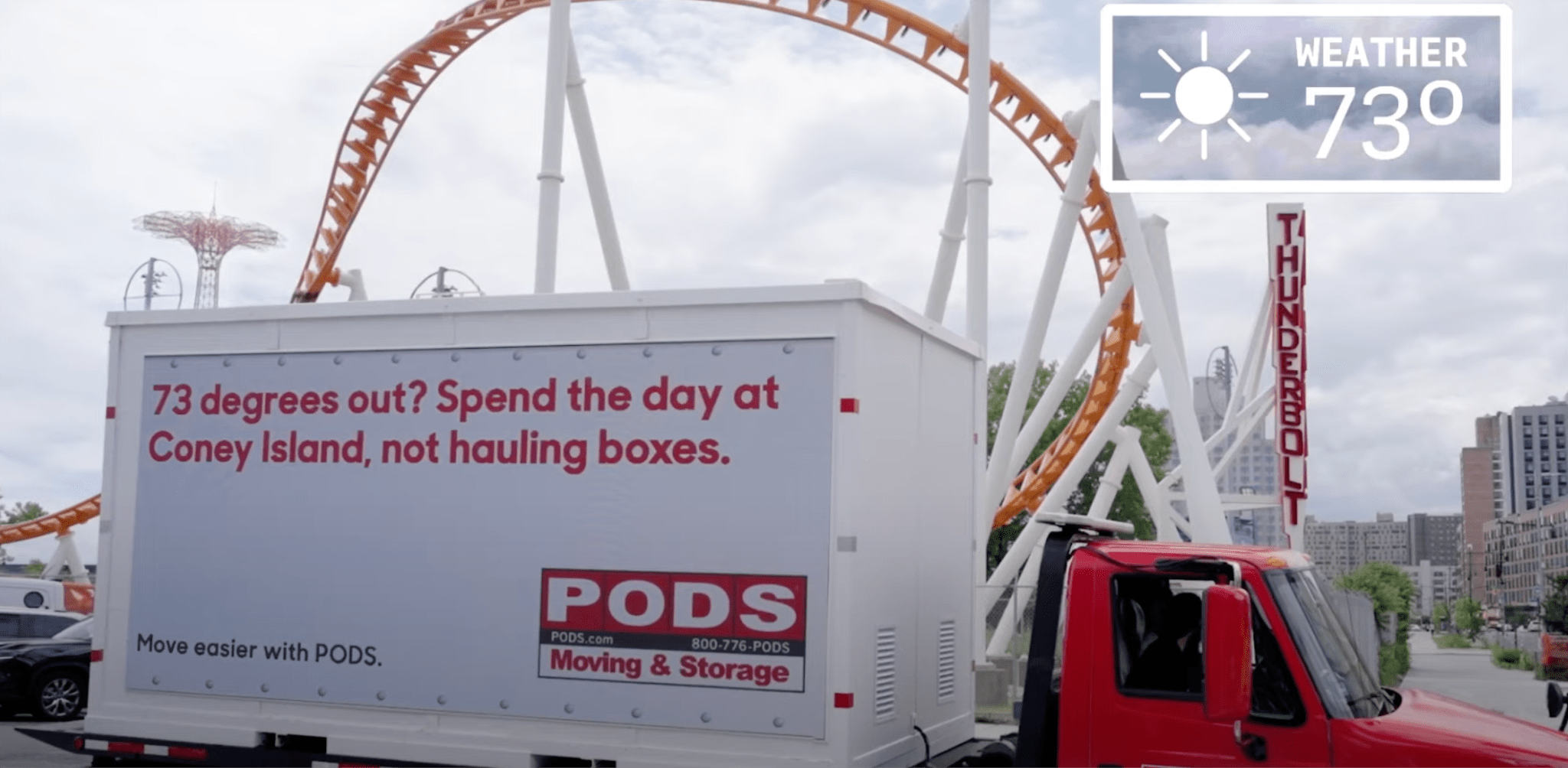 A still from a Google video showing a lorry with an ai-generated billboard for Pods moving and storage company. The billboard messaging changes depending on the weather and location. 