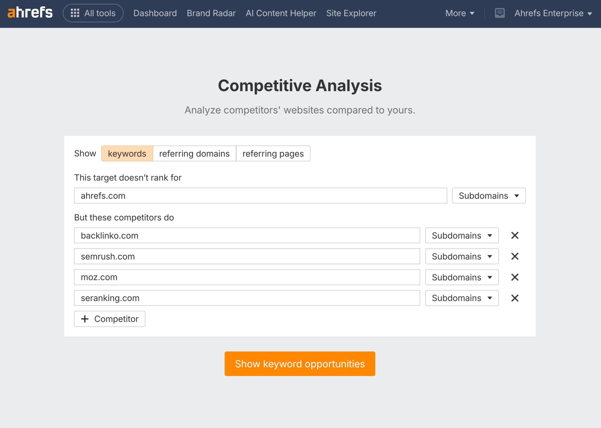 Screenshot of Ahrefs Competitive Analysis tool homepage showing Ahrefs.com in the "this target doesn't rank for" search field, and backlinko, semrush, moz, and seranking in the search field "But these competitors do"