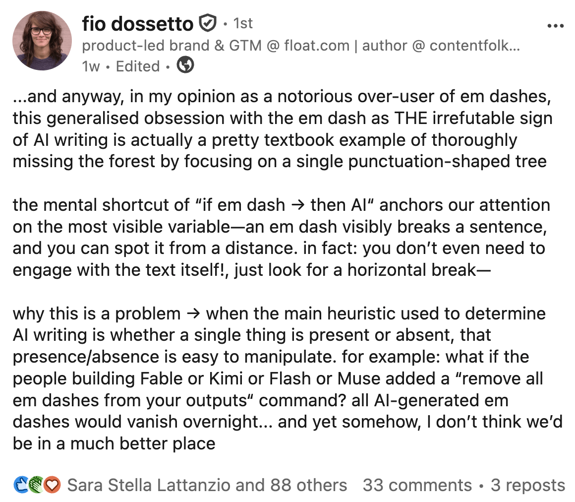 A LinkedIn post by Fio Dossetto arguing that using em dashes as a sign of AI writing is flawed.